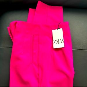 Brand new high waistline Side pockets, front zipper, v line on the back.